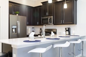 Family Townhome, 2 Bedrooms | Private kitchen | Full-size fridge, microwave, oven, stovetop - Luxury 2 Bd Close to Disney @ Champions Gate 1071 (Davenport)