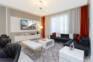 Family Townhome, 4 Bedrooms | Living area | 60-inch Smart TV with cable channels, Netflix, Hulu