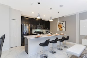 Family Townhome, 4 Bedrooms | Private kitchen | Full-size fridge, microwave, oven, stovetop