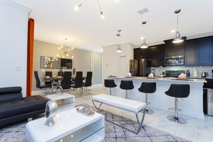 Family Townhome, 4 Bedrooms | Living area | 60-inch Smart TV with cable channels, Netflix, Hulu