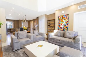 Family Townhome, 4 Bedrooms | Living area | 60-inch Smart TV with cable channels, TV, Netflix - Marvelous 4 Bd Close to Disney @ Magic Village 3153 (Kissimmee)