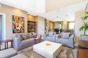 Family Townhome, 4 Bedrooms | Living area | 60-inch Smart TV with cable channels, Netflix, Hulu - Stunning 4 Bd Close To Disney @ Magic Village 3247 (Kissimmee)