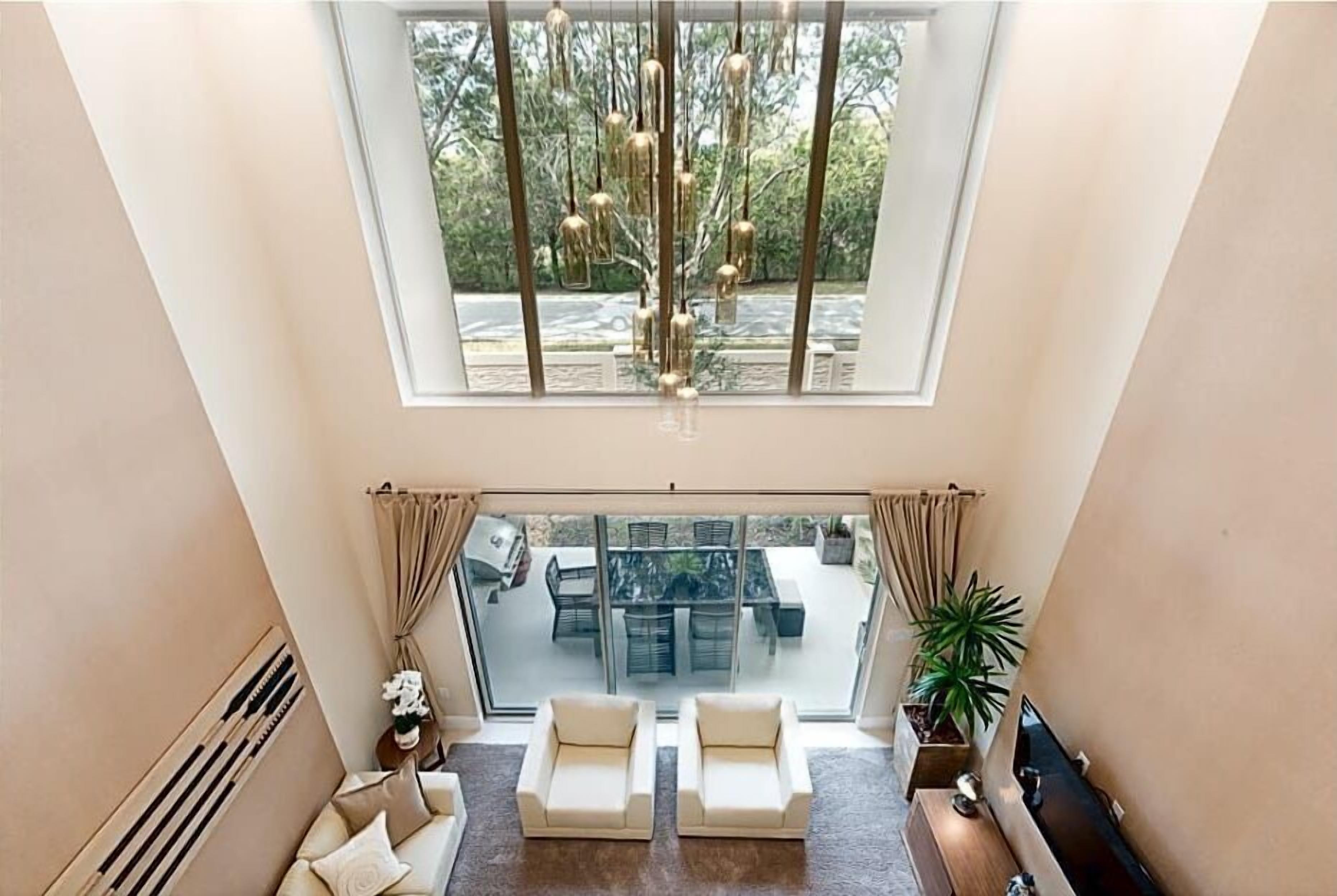 Family Townhome, 4 Bedrooms | Living area | 60-inch Smart TV with cable channels, TV, Netflix