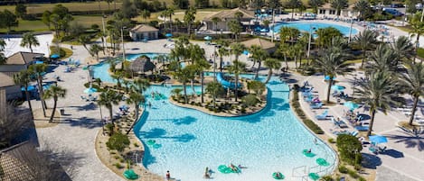 Outdoor pool, pool loungers, lifeguards on site