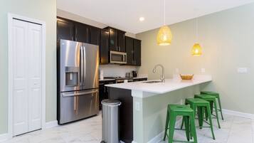 Family Townhome, 5 Bedrooms | Private kitchen | Full-sized fridge, microwave, oven, stovetop