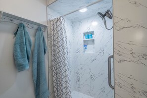 Shower, hair dryer, towels, soap