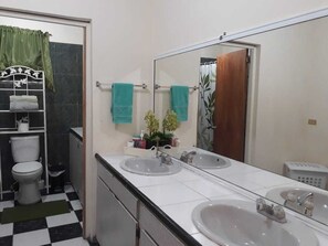 Combined shower/bathtub, towels, soap, toilet paper