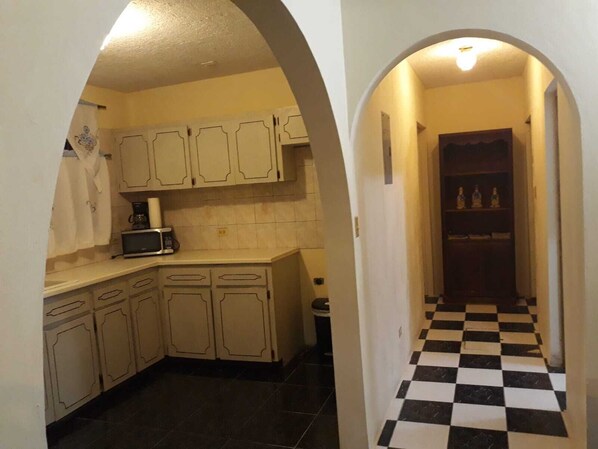 Microwave, stovetop, dining tables