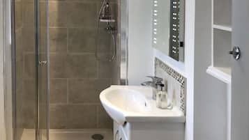 Combined shower/bathtub, hair dryer, towels, soap