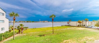 Waterfront condo with pool, central AC, washer/dryer, and WiFi