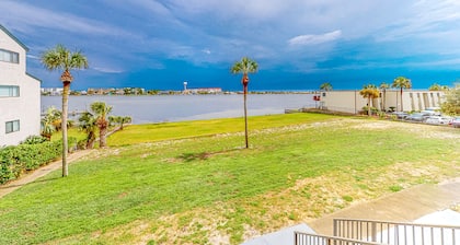 Waterfront condo with pool, central AC, washer/dryer, and WiFi