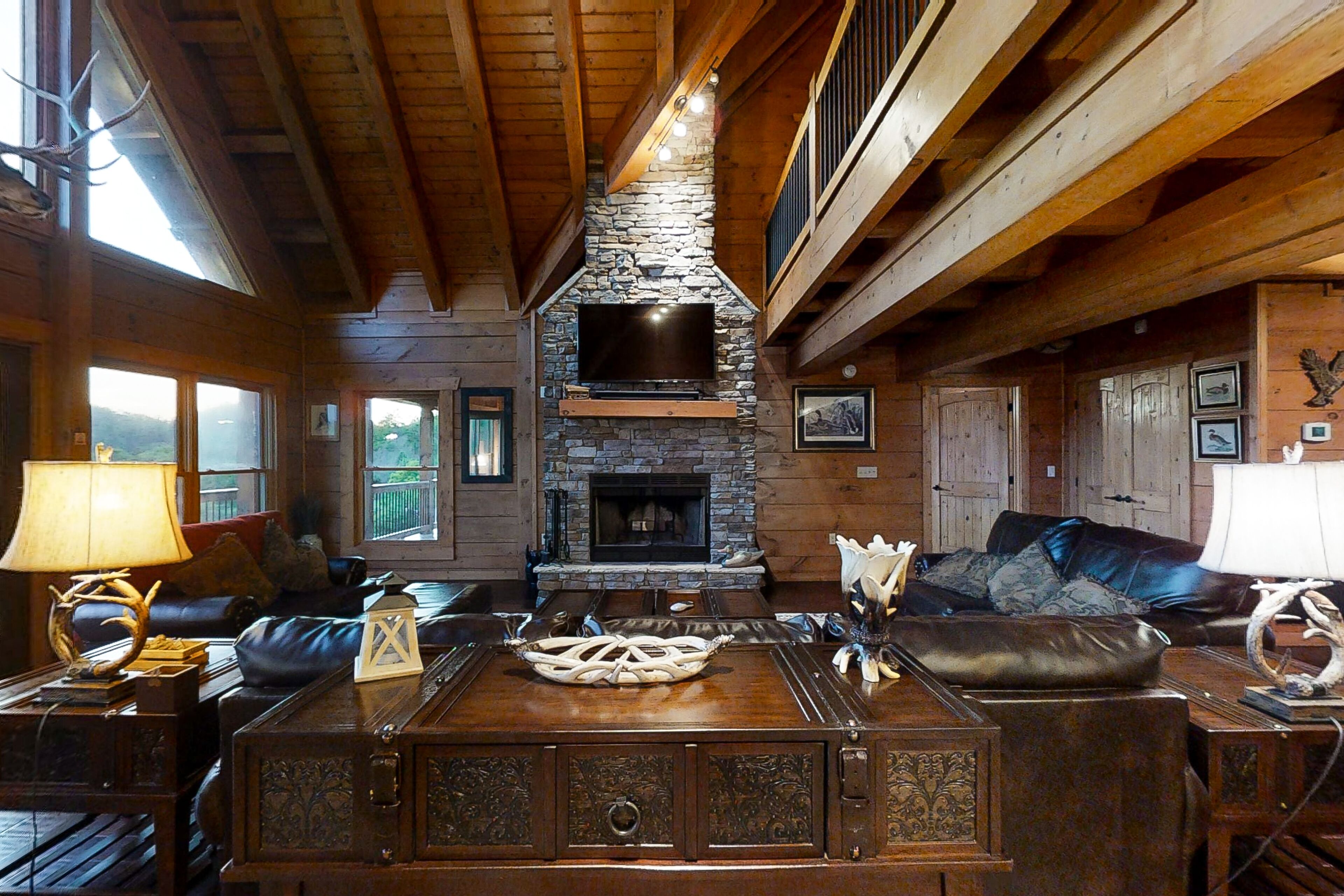 Three-story lake-view cabin with private hot tub, pool table, fireplace & AC