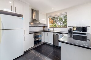 Coffee/tea maker, fridge, microwave, oven