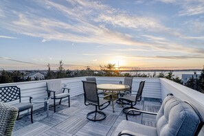 Outdoor dining - Historic, dog-friendly beach view house with fast WiFi, ocean view, & grill (Oak Bluffs)