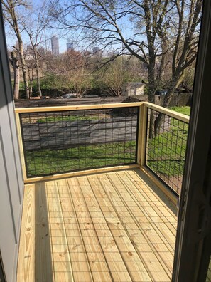 Enjoy a serene view of the park from this deck.