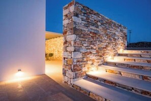 Steps lead up to a welcoming entrance with a clean, contemporary design.