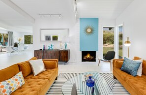 Smart TV, fireplace, books, stereo
