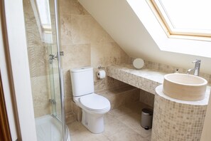 Bathtub, hair dryer, bidet, towels