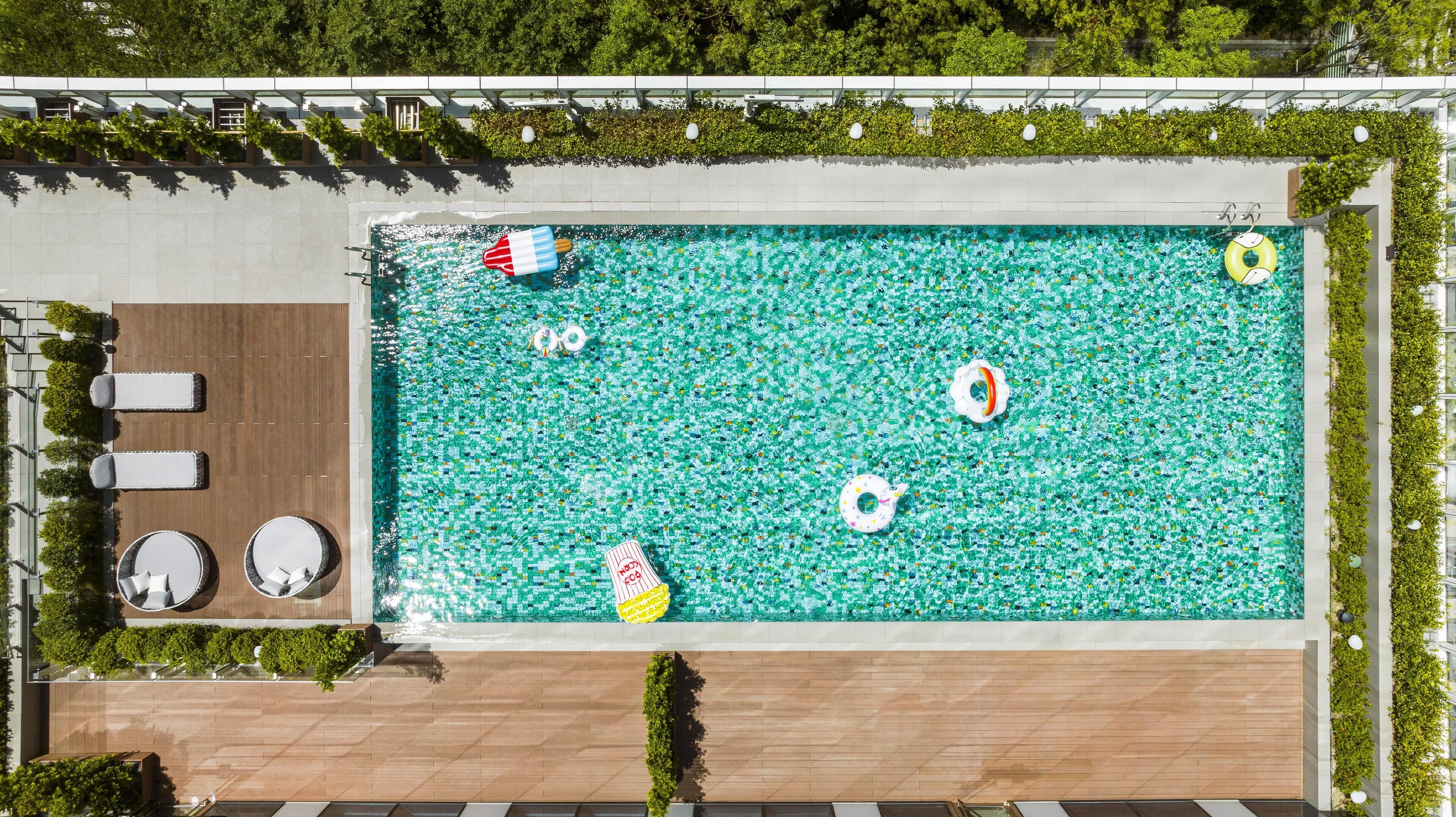 Seasonal outdoor pool, open 8:00 AM to 8:00 PM, pool umbrellas