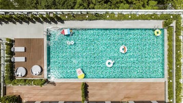 Seasonal outdoor pool, open 8:00 AM to 8:00 PM, pool umbrellas