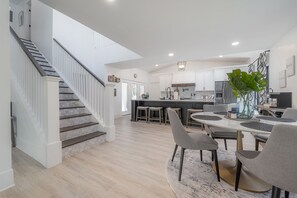 Enjoy meals in the kitchen with stainless steel appliances and a central island, then dine at the round table with comfortable seating.