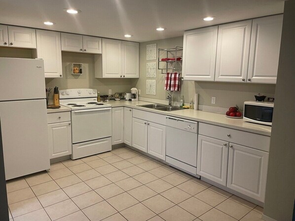 Fridge, coffee/tea maker, cookware/dishes/utensils, spices