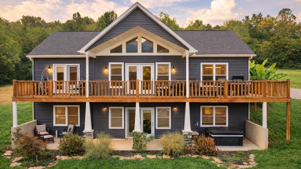 A two-story house with a balcony, a covered porch, and a landscaped front yard. - Serenity on Siverly: Saltwater pool and amazing view (McArthur)