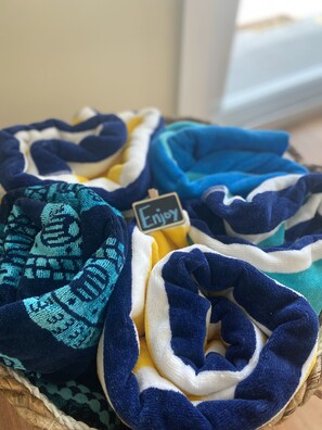 A basket of folded blankets in various colors. - Catch n' Relax Anglers Ultimate Waterfront Retreat with 50’ Dock Modern New Home (Marathon)