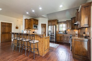 Fridge, microwave, oven, stovetop - Stunning Skiatook Lake Three Story Getaway (Sperry)