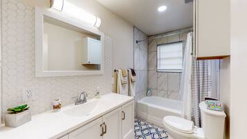 Combined shower/tub, hair dryer, towels, soap