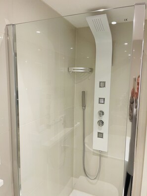 Bathtub, hair dryer, towels, soap