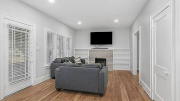 Smart TV, fireplace, foosball, books