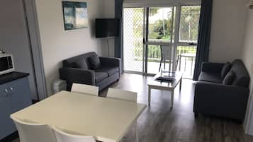 Premium Apartment, 2 Bedrooms, Garden View | Living area | Flat-screen TV