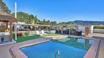 Outdoor pool, open 7:00 AM to 9:00 PM, pool umbrellas, sun loungers