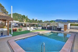 Outdoor pool, open 7:00 AM to 9:00 PM, pool umbrellas, pool loungers