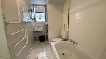 Combined shower/bathtub, hair dryer, towels, soap