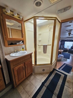 Shower, towels, soap, toilet paper