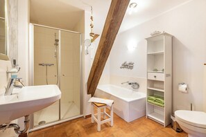 Bathtub, hair dryer, towels