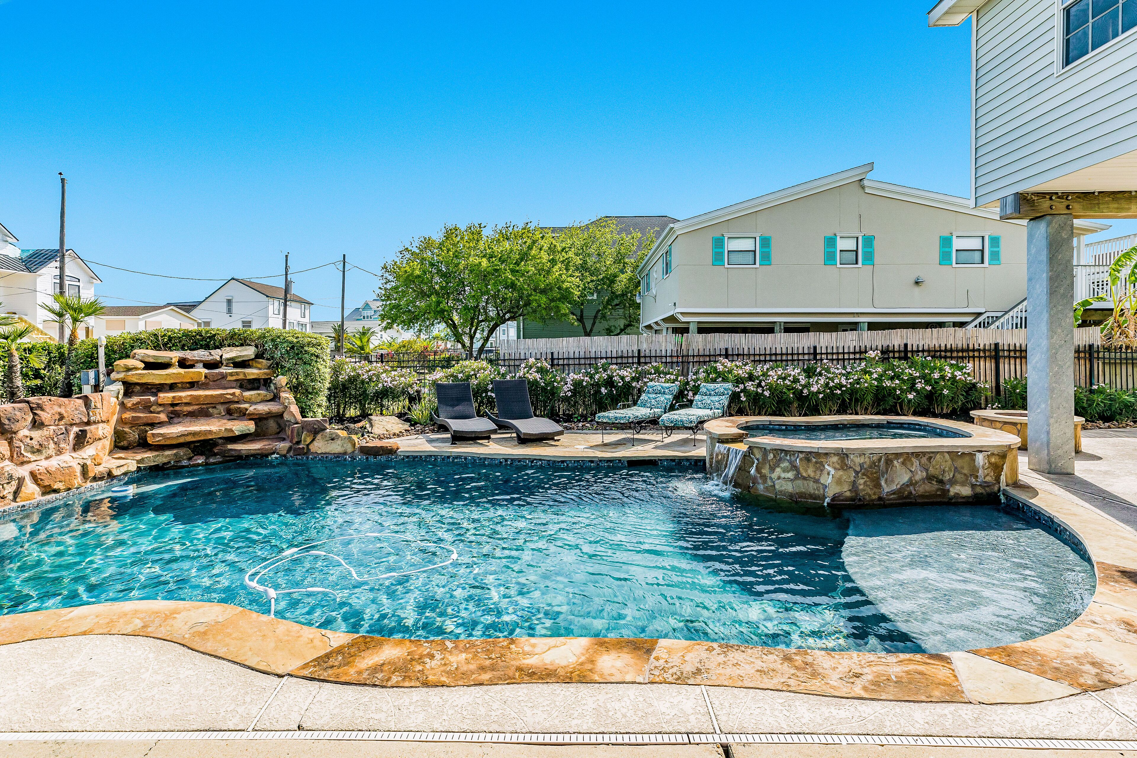 Canal-front home with private pool & pool spa, dock, kayak, SUP - walk to beach