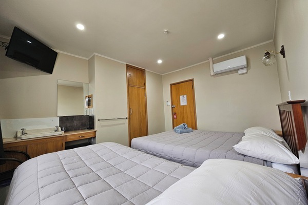 Basic Triple Room, 1 Bedroom, Shared Bathroom | Individually furnished, laptop workspace, free WiFi, bed sheets