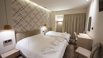 Habitación triple | Minibar, wifi gratis y ropa de cama