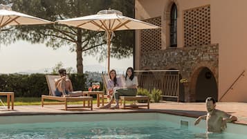 2 outdoor pools, open 8:00 AM to 8:00 PM, pool umbrellas, pool loungers