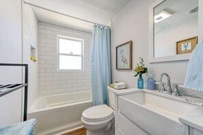 Bathtub, hair dryer, towels