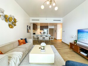 Deluxe Apartment | Living area | 32-inch LCD TV with cable channels, TV