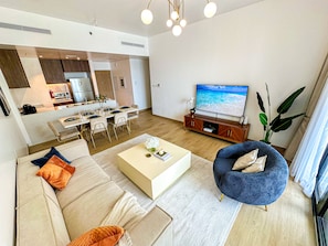 Deluxe Apartment | Living area | 32-inch LCD TV with cable channels, TV