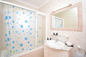 Bathtub, hair dryer, towels