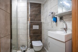 Shower, hair dryer, slippers, towels