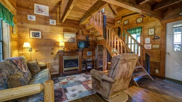 The Duck Cabin | Living area | 32-inch flat-screen TV with satellite channels, TV, fireplace