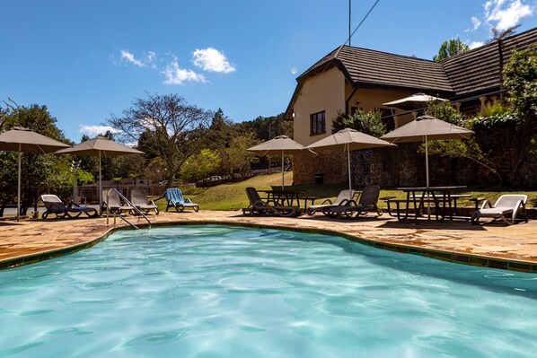 Indoor pool, outdoor pool, pool umbrellas, pool loungers