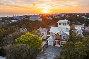A residential area with houses during sunset. - Luxury Seagrove Home with Private Pool, Rooftop Spa, Elevator, and LSV (Santa Rosa Beach)
